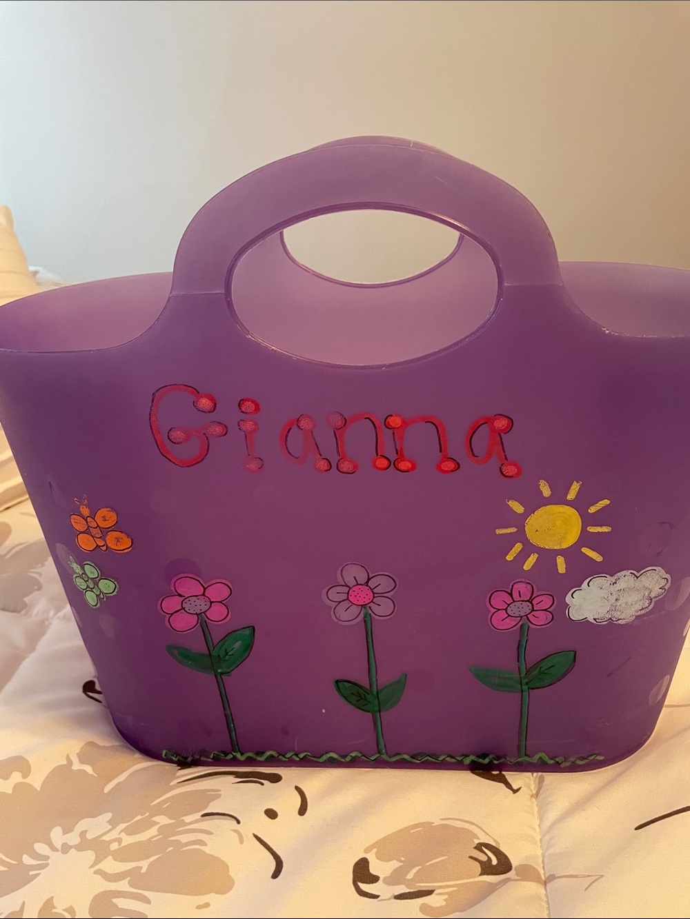 Flexible plastic tote with the name Gianna on it. Gently used.